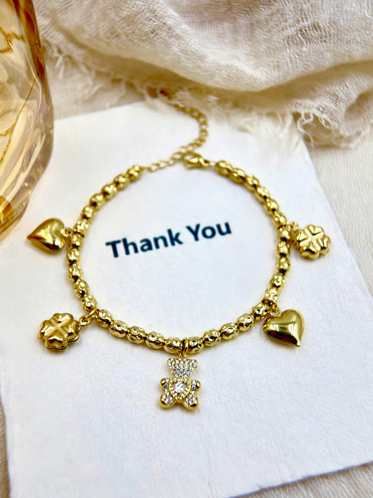 Vintage Gold Beaded Charm Bracelet with Crystal Teddy Bear, Clover & Heart Charms | Cute Gift for Her | Trendy Women's Jewelry