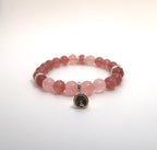 Bracelet à breloques cloche de Noël avec quartz rose et fraise