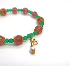 Bracelet fait main en quartz fraise et agate verte avec breloque en forme de gourde argentée