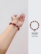 Bracelet en veines de dragon rouge et agate verte avec breloque flocon de neige argentée